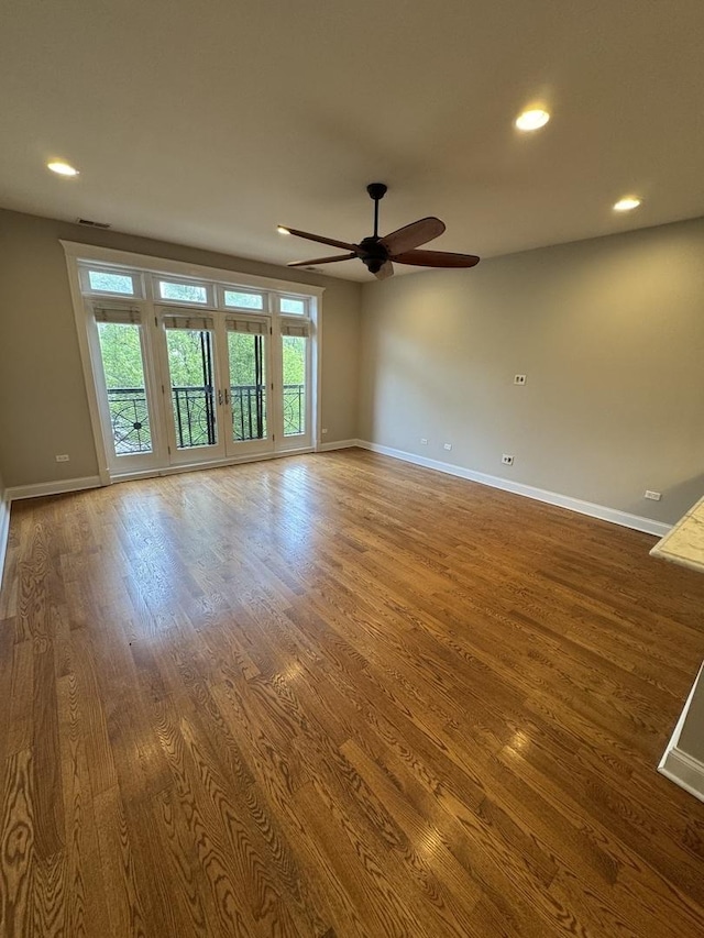 1304 N Wood St Unit 2, Chicago, IL 60622 - spare room featuring wood finished floors, a ceiling fan, baseboards, and recessed lighting
