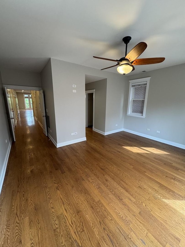 1304 N Wood St Unit 2, Chicago, IL 60622 - empty room with ceiling fan, wood finished floors, and baseboards