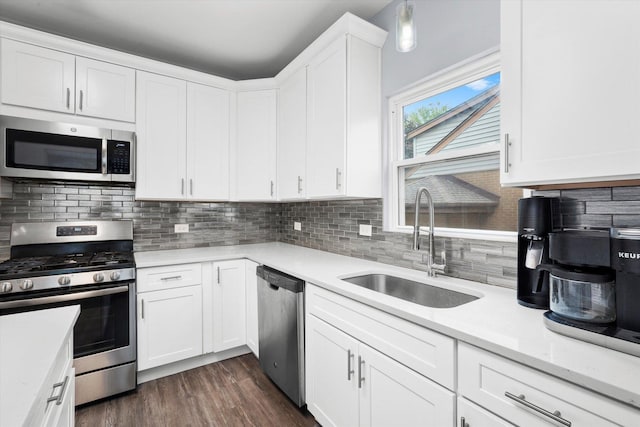 3534 Clarence Ave, Berwyn, IL 60402 - kitchen with stainless steel appliances, a sink, light countertops, backsplash, and white cabinets