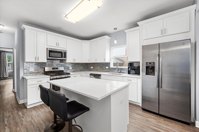3534 Clarence Ave, Berwyn, IL 60402 - kitchen with appliances with stainless steel finishes, a sink, plenty of natural light, and wood finished floors