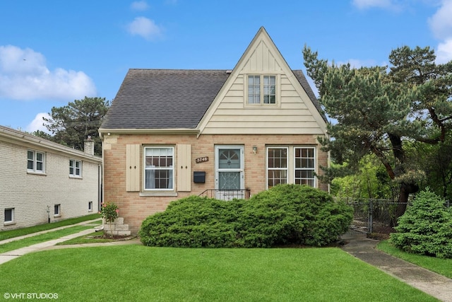 5748 N Lansing Ave, Chicago, IL 60646 - view of front of home featuring brick siding and a shingled roof