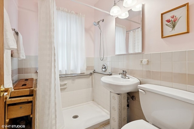 5748 N Lansing Ave, Chicago, IL 60646 - full bathroom featuring tile walls, toilet, a tile shower, and a wainscoted wall