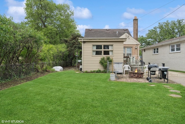 5748 N Lansing Ave, Chicago, IL 60646 - back of house with an outdoor fire pit, a patio, a chimney, and a shingled roof