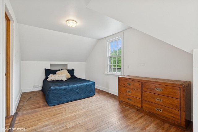 5748 N Lansing Ave, Chicago, IL 60646 - bedroom featuring light wood finished floors, lofted ceiling, and baseboards