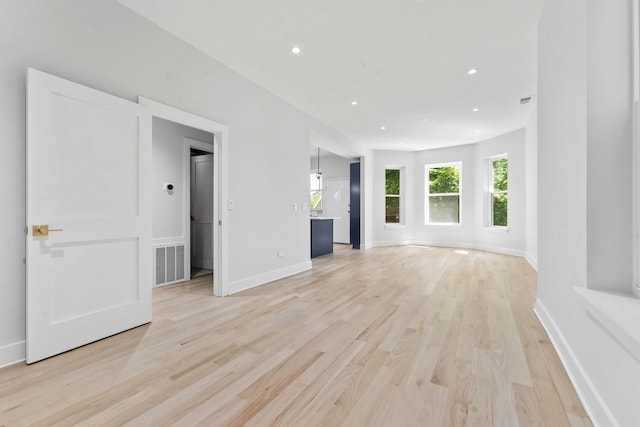 6233 S Woodlawn Ave Unit 2, Chicago, IL 60637 - unfurnished living room with light wood-style floors, recessed lighting, and baseboards