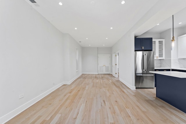 6233 S Woodlawn Ave Unit 2, Chicago, IL 60637 - unfurnished living room with recessed lighting, light wood finished floors, and baseboards