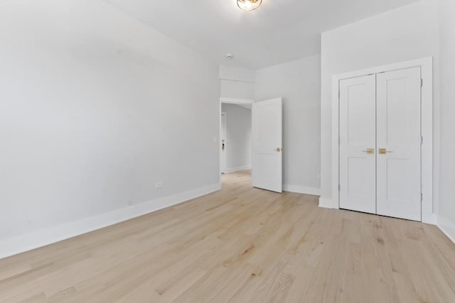 6233 S Woodlawn Ave Unit 2, Chicago, IL 60637 - unfurnished bedroom featuring light wood-type flooring and baseboards