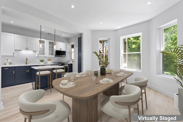 6233 S Woodlawn Ave Unit 2, Chicago, IL 60637 - dining space with light wood finished floors, recessed lighting, and baseboards