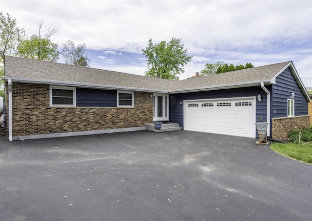 3106 Lebanon Ave, Zion, IL 60099 - single story home featuring brick siding, an attached garage, and asphalt driveway