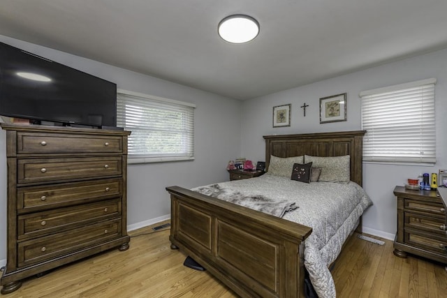 3106 Lebanon Ave, Zion, IL 60099 - bedroom featuring light wood-type flooring and baseboards