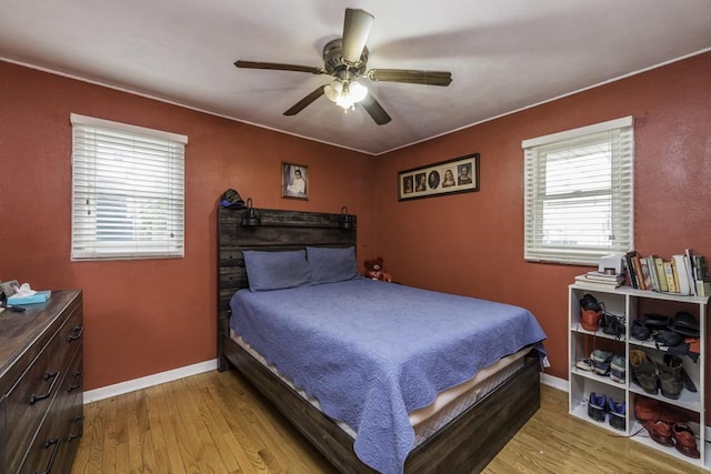 3106 Lebanon Ave, Zion, IL 60099 - bedroom with light wood-style flooring, baseboards, and a ceiling fan