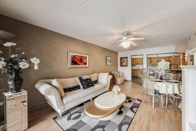 5555 N Cumberland Ave Unit 309, Chicago, IL 60656 - living area featuring light wood-style floors and ceiling fan
