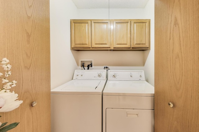 5555 N Cumberland Ave Unit 309, Chicago, IL 60656 - laundry area featuring washer and clothes dryer and cabinet space