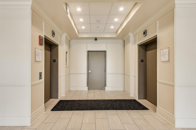 5555 N Cumberland Ave Unit 309, Chicago, IL 60656 - corridor featuring elevator, recessed lighting, and a tray ceiling