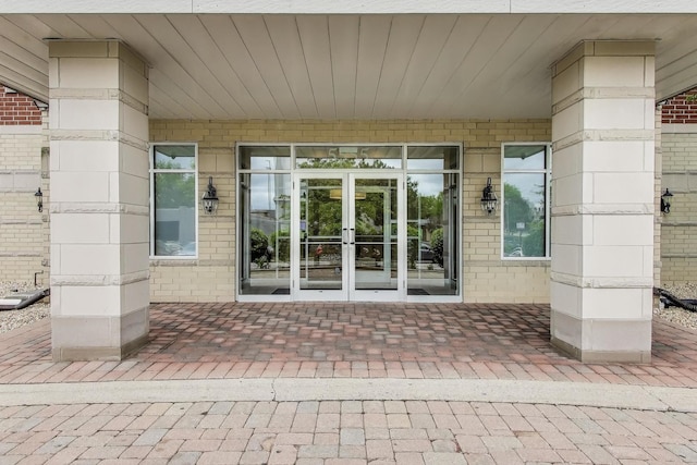 5555 N Cumberland Ave Unit 309, Chicago, IL 60656 - doorway to property featuring french doors and brick siding