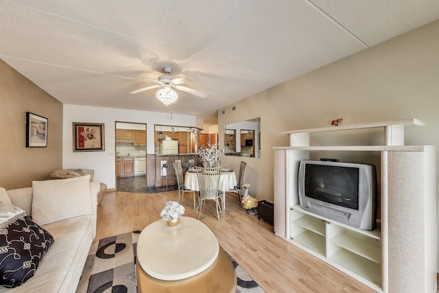 5555 N Cumberland Ave Unit 309, Chicago, IL 60656 - living room with ceiling fan and light wood-style flooring