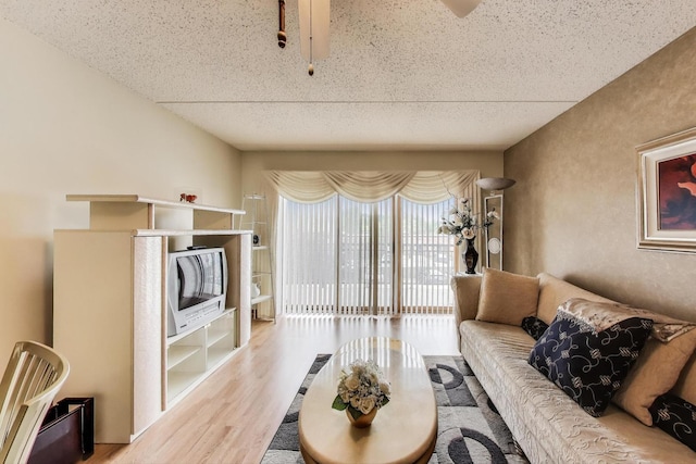 5555 N Cumberland Ave Unit 309, Chicago, IL 60656 - living room with wood finished floors and a textured ceiling