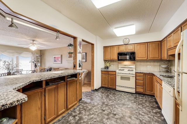 5555 N Cumberland Ave Unit 309, Chicago, IL 60656 - kitchen with white appliances, a textured ceiling, brown cabinetry, a ceiling fan, and light stone counters