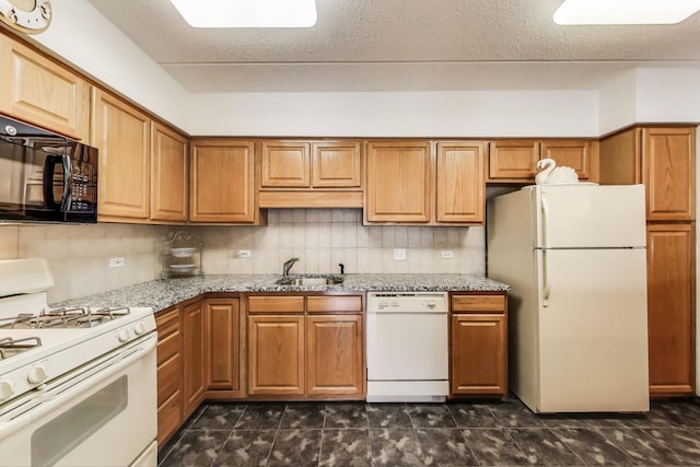 5555 N Cumberland Ave Unit 309, Chicago, IL 60656 - kitchen featuring white appliances, light stone countertops, tasteful backsplash, and brown cabinetry