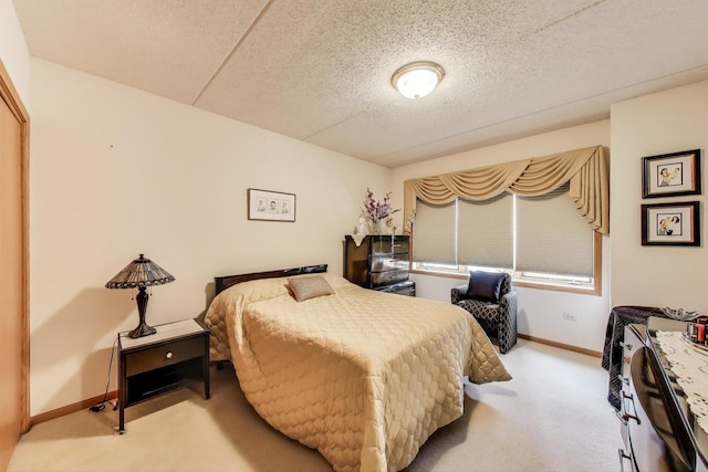 5555 N Cumberland Ave Unit 309, Chicago, IL 60656 - carpeted bedroom with baseboards and a textured ceiling