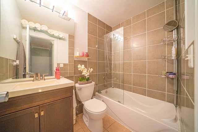 1352 Quaker Ln Unit 154C, Prospect Heights, IL 60070 - full bathroom with tile walls, vanity, toilet, tile patterned flooring, and tub / shower combination