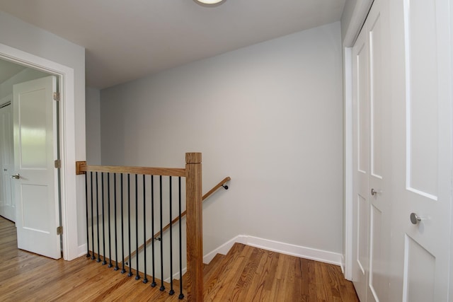 1770 Henley St Unit C, Glenview, IL 60025 - hall featuring an upstairs landing, wood finished floors, and baseboards