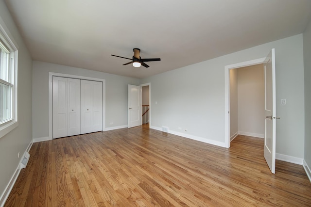 1770 Henley St Unit C, Glenview, IL 60025 - unfurnished bedroom featuring light wood-style flooring, baseboards, a closet, and ceiling fan