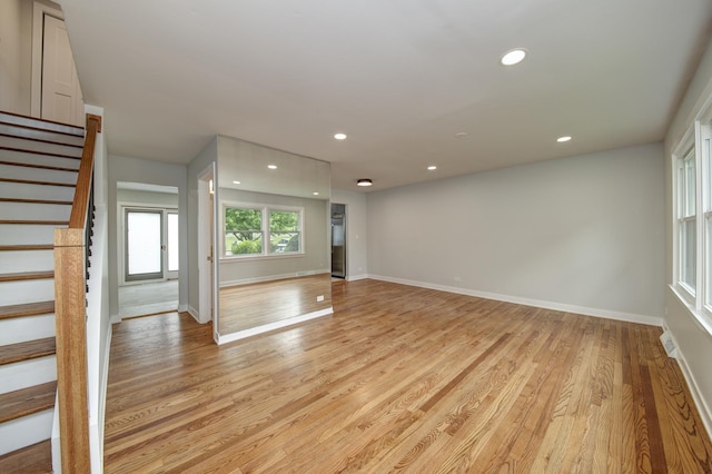 1770 Henley St Unit C, Glenview, IL 60025 - spare room with stairway, light wood finished floors, recessed lighting, and baseboards