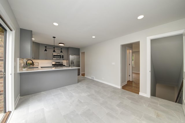 1770 Henley St Unit C, Glenview, IL 60025 - kitchen with appliances with stainless steel finishes, gray cabinets, light countertops, a sink, and recessed lighting