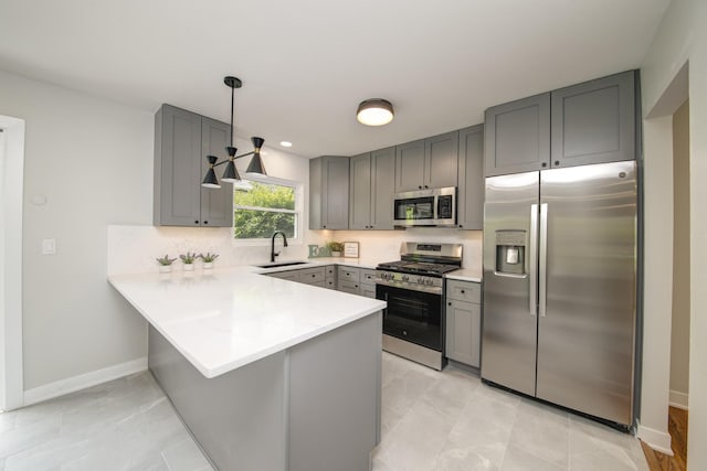 1770 Henley St Unit C, Glenview, IL 60025 - kitchen with stainless steel appliances, gray cabinetry, a peninsula, light countertops, and recessed lighting