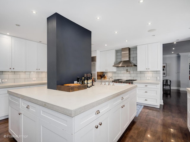3920 N Lake Shore Dr Unit 12N, Chicago, IL 60613 - kitchen featuring wall chimney range hood, backsplash, light countertops, recessed lighting, and ornamental molding