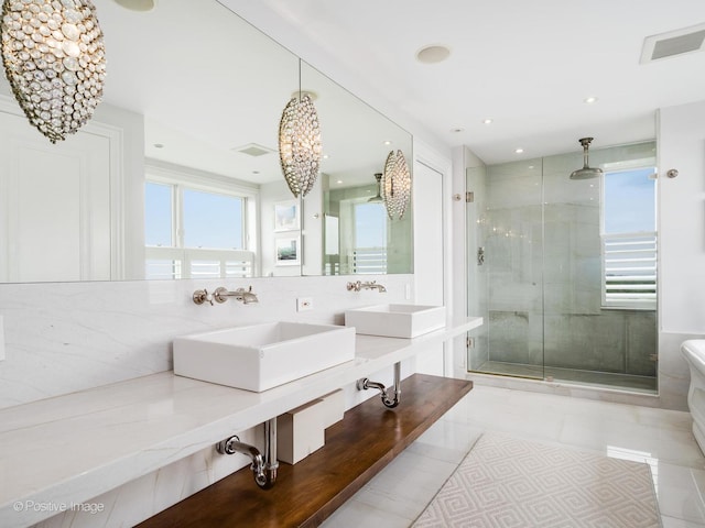 3920 N Lake Shore Dr Unit 12N, Chicago, IL 60613 - full bathroom featuring a shower stall, double vanity, recessed lighting, and backsplash