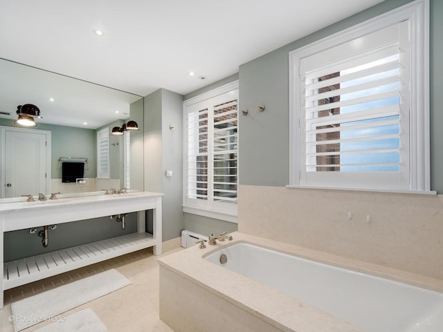 3920 N Lake Shore Dr Unit 12N, Chicago, IL 60613 - bathroom featuring a garden tub, double vanity, and recessed lighting