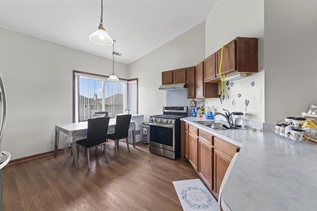 11036 Jodan Dr Unit 3D, Oak Lawn, IL 60453 - kitchen with stainless steel gas range oven, under cabinet range hood, light countertops, a sink, and hanging light fixtures