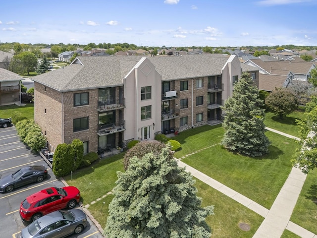 11036 Jodan Dr Unit 3D, Oak Lawn, IL 60453 - view of building exterior featuring uncovered parking and a residential view
