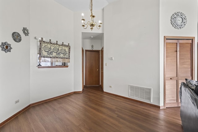 11036 Jodan Dr Unit 3D, Oak Lawn, IL 60453 - unfurnished dining area featuring a chandelier, wood finished floors, baseboards, and a high ceiling
