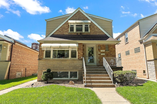 3840 S Wolcott Ave, Chicago, IL 60609 - view of front of property with a front lawn, roof with shingles, stone siding, and covered porch
