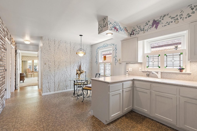 3840 S Wolcott Ave, Chicago, IL 60609 - kitchen with a sink, plenty of natural light, light countertops, and tile patterned floors