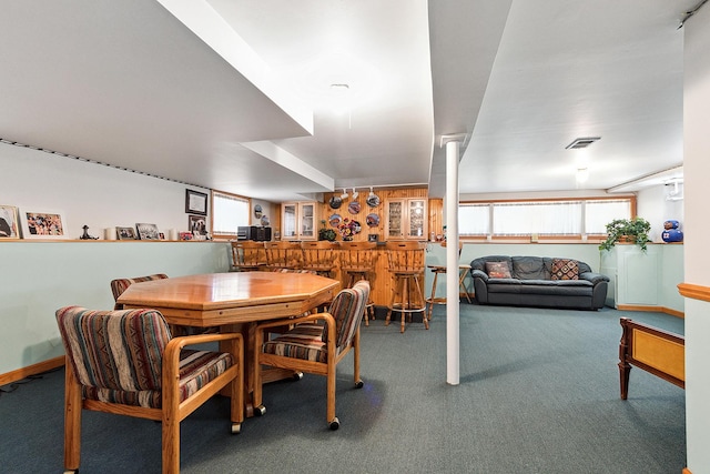 3840 S Wolcott Ave, Chicago, IL 60609 - dining area with bar, carpet floors, and baseboards