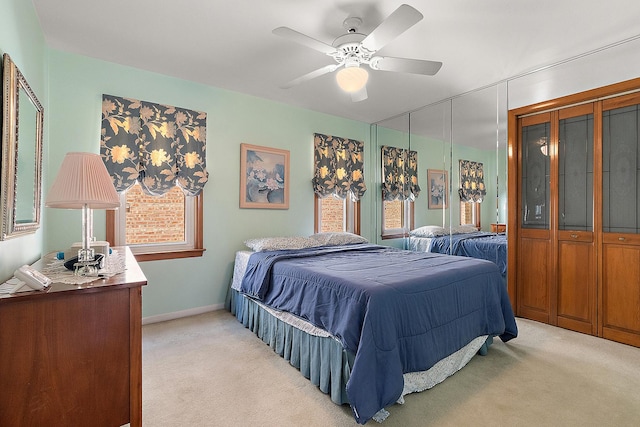 3840 S Wolcott Ave, Chicago, IL 60609 - bedroom with light carpet, multiple windows, ceiling fan, and baseboards