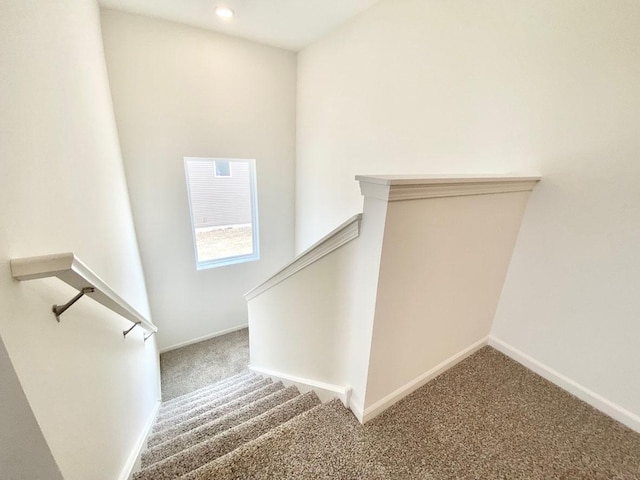 staircase with carpet floors, baseboards, and recessed lighting