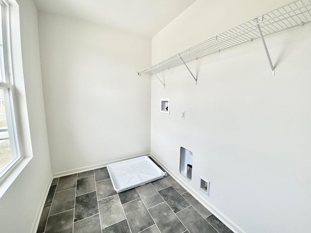 washroom featuring hookup for a washing machine and baseboards