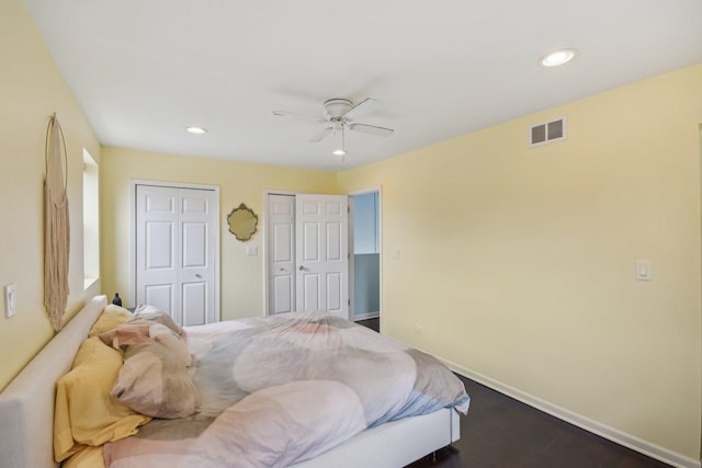 1830 W 18th St, Chicago, IL 60608 - bedroom featuring multiple closets, baseboards, recessed lighting, a ceiling fan, and wood finished floors