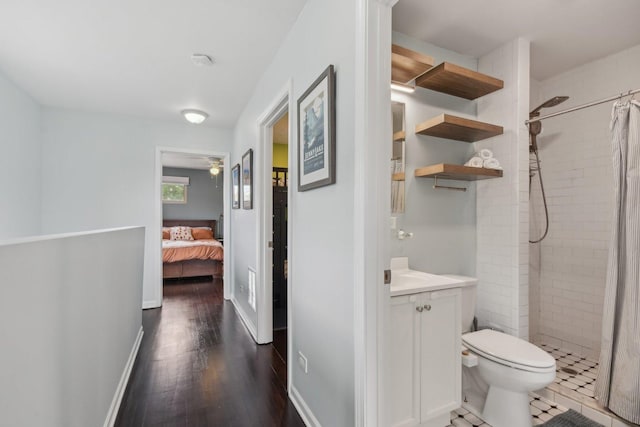 1830 W 18th St, Chicago, IL 60608 - ensuite bathroom featuring vanity, a tile shower, toilet, and wood finished floors