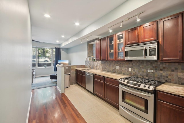 1830 W 18th St, Chicago, IL 60608 - kitchen with stainless steel appliances, track lighting, a sink, light stone counters, and recessed lighting