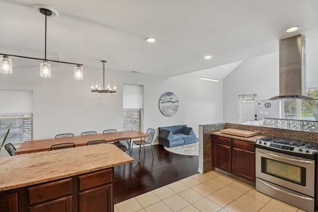 1830 W 18th St, Chicago, IL 60608 - kitchen with gas range, island exhaust hood, open floor plan, a chandelier, and pendant lighting