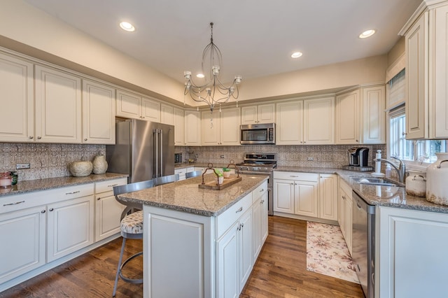 2105 Lillian Ln, Lisle, IL 60532 - kitchen with stainless steel appliances, a sink, decorative backsplash, a center island, and recessed lighting
