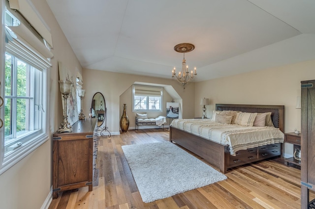 2105 Lillian Ln, Lisle, IL 60532 - bedroom with a chandelier, wood finished floors, and baseboards
