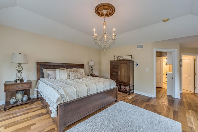 2105 Lillian Ln, Lisle, IL 60532 - bedroom with vaulted ceiling, wood finished floors, a chandelier, and baseboards