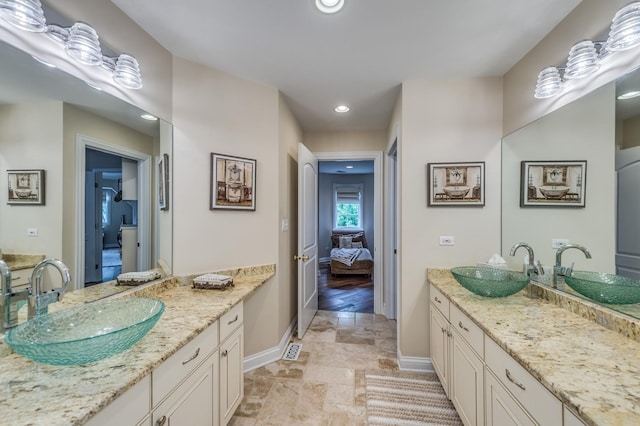 2105 Lillian Ln, Lisle, IL 60532 - ensuite bathroom featuring baseboards, vanity, recessed lighting, and stone finish flooring